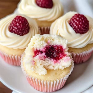 Almond Wedding Cake Cupcakes with Raspberry Filling
